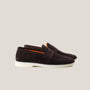 A pair of dark brown suede penny loafers with a white sole.